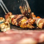 flipping-chicken-and-veggie-kabob-on-grill
